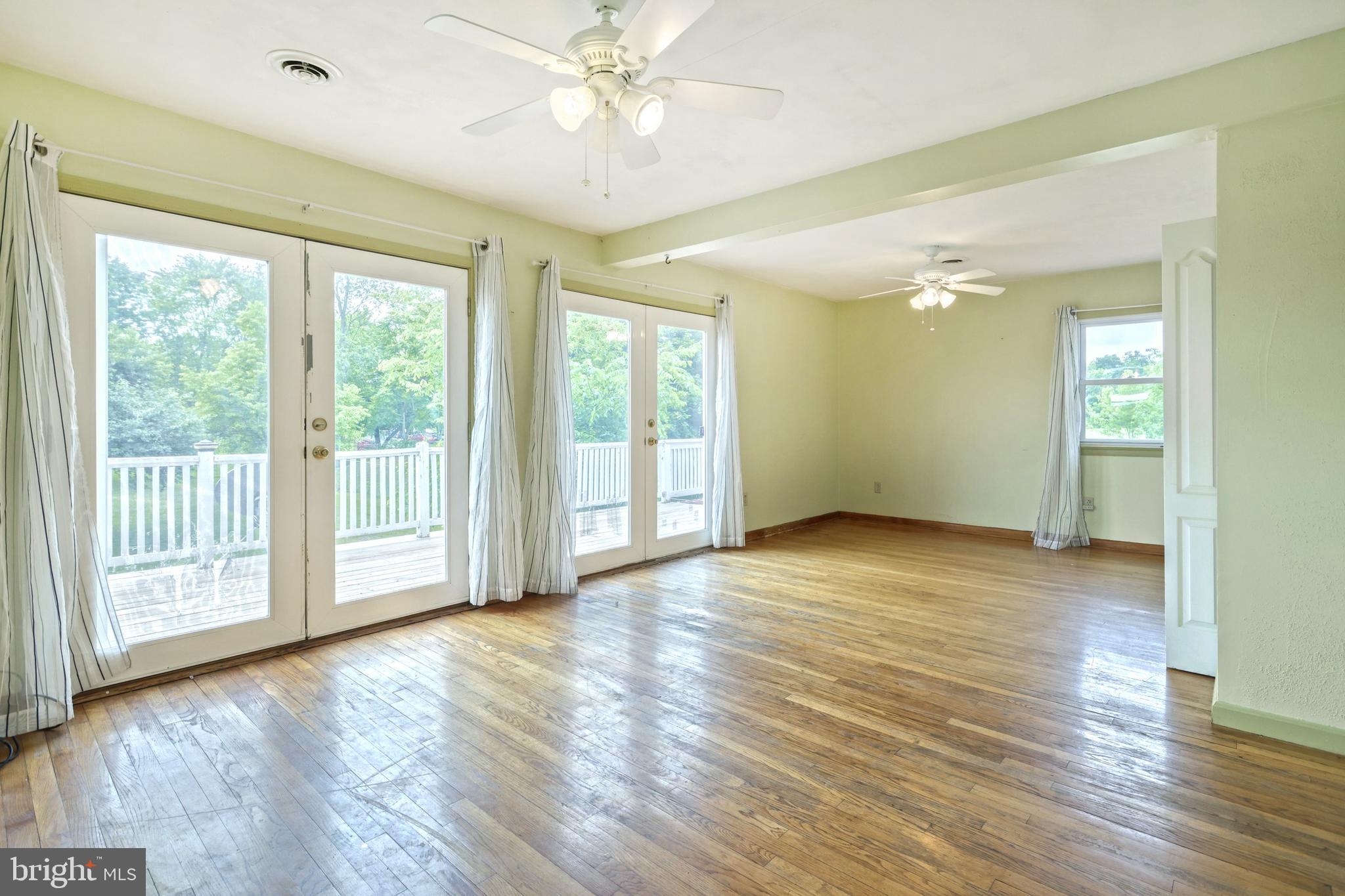 147 Mud College Road Littlestown, PA 17340 - Photo 16 of 43 a view of an empty room with wooden floor and a window