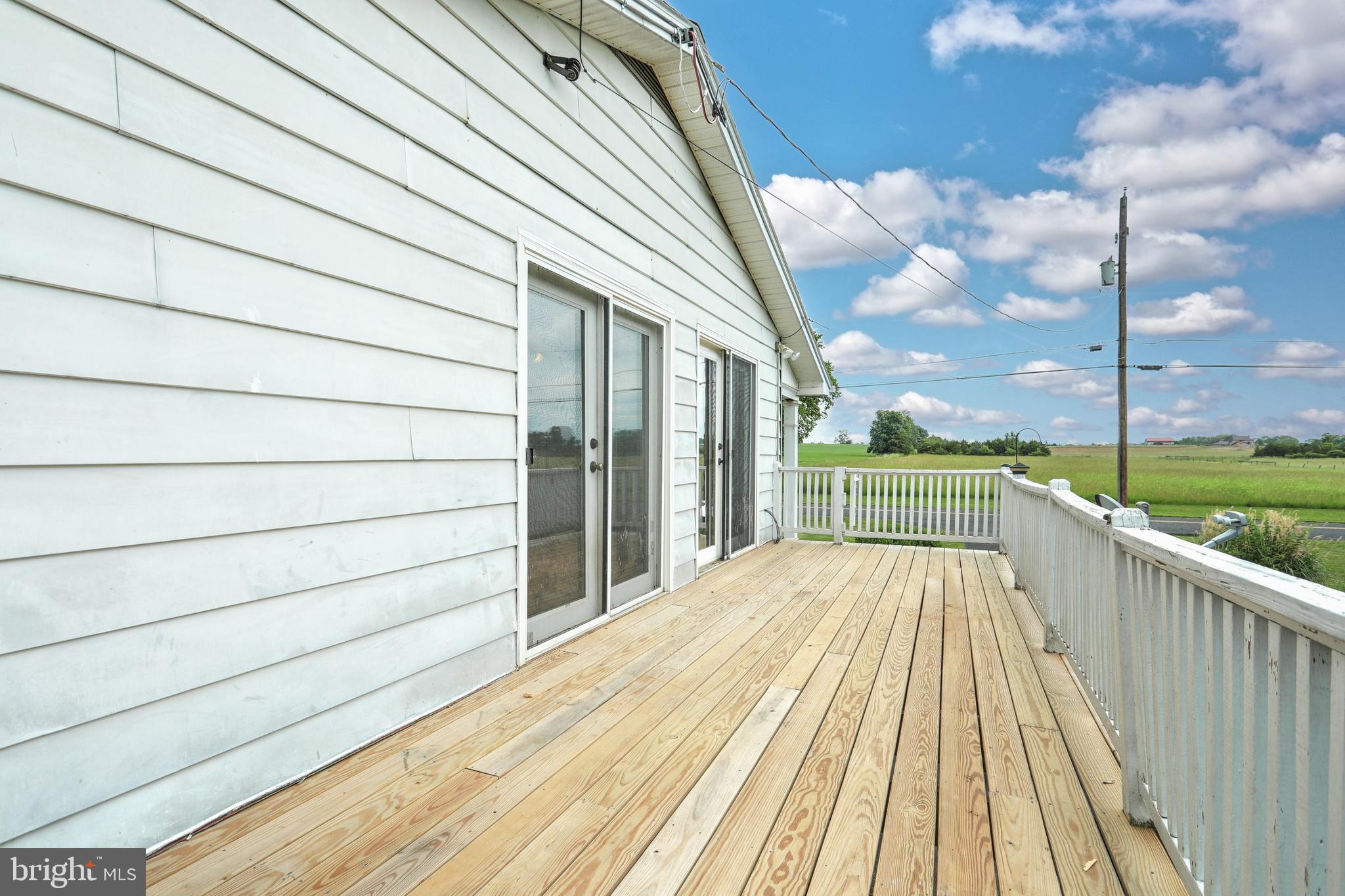 147 Mud College Road Littlestown, PA 17340 - Photo 33 of 43 a view of a balcony with wooden floor and fence