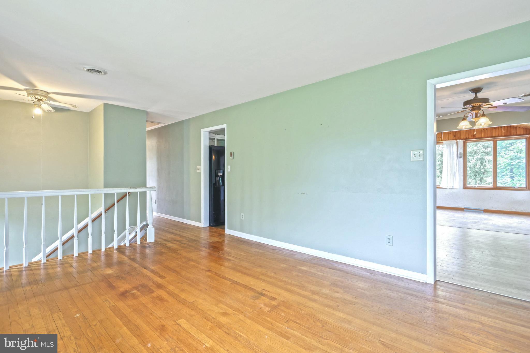 147 Mud College Road Littlestown, PA 17340 - Photo 7 of 43 a view of a hallway with wooden floor and windows