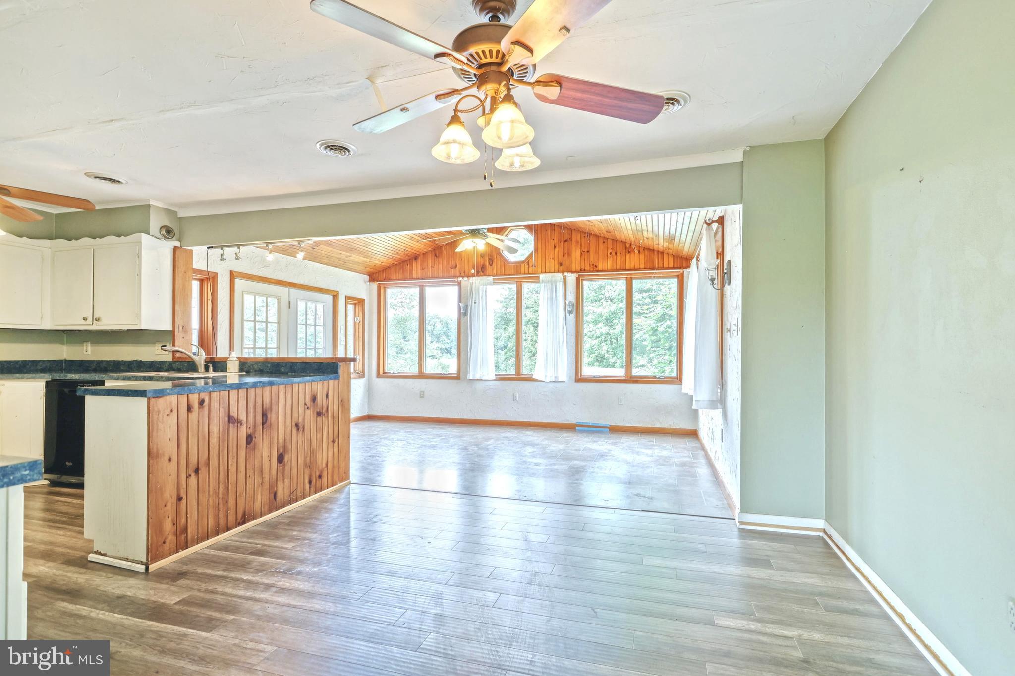 147 Mud College Road Littlestown, PA 17340 - Photo 8 of 43 a view of open kitchen with wooden floor and window