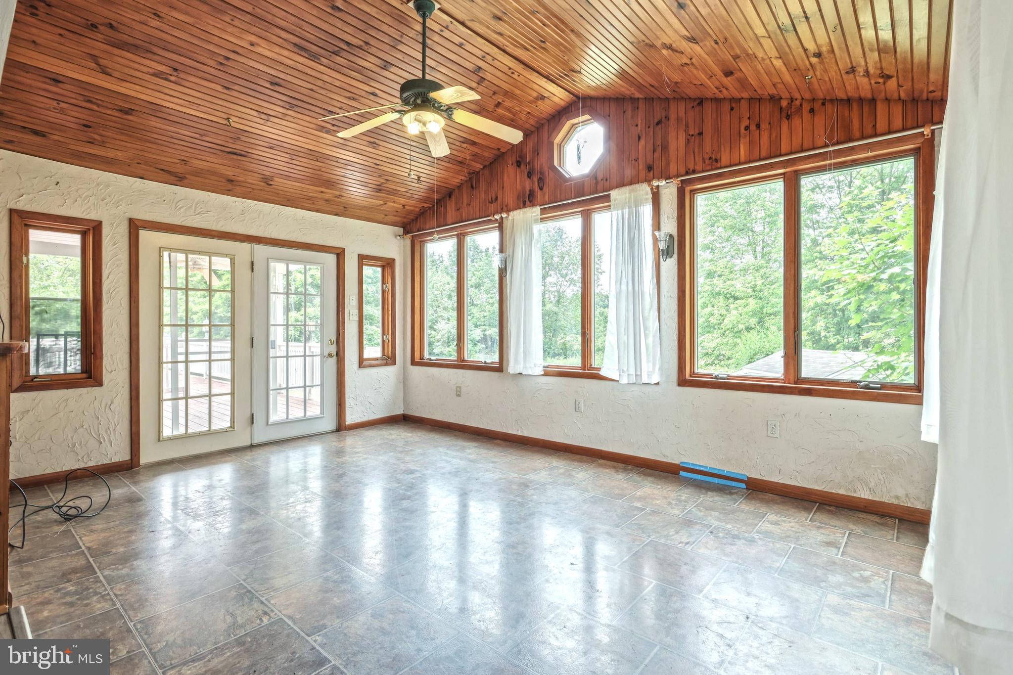 147 Mud College Road Littlestown, PA 17340 - Photo 9 of 43 a view of an empty room with wooden floor and a window
