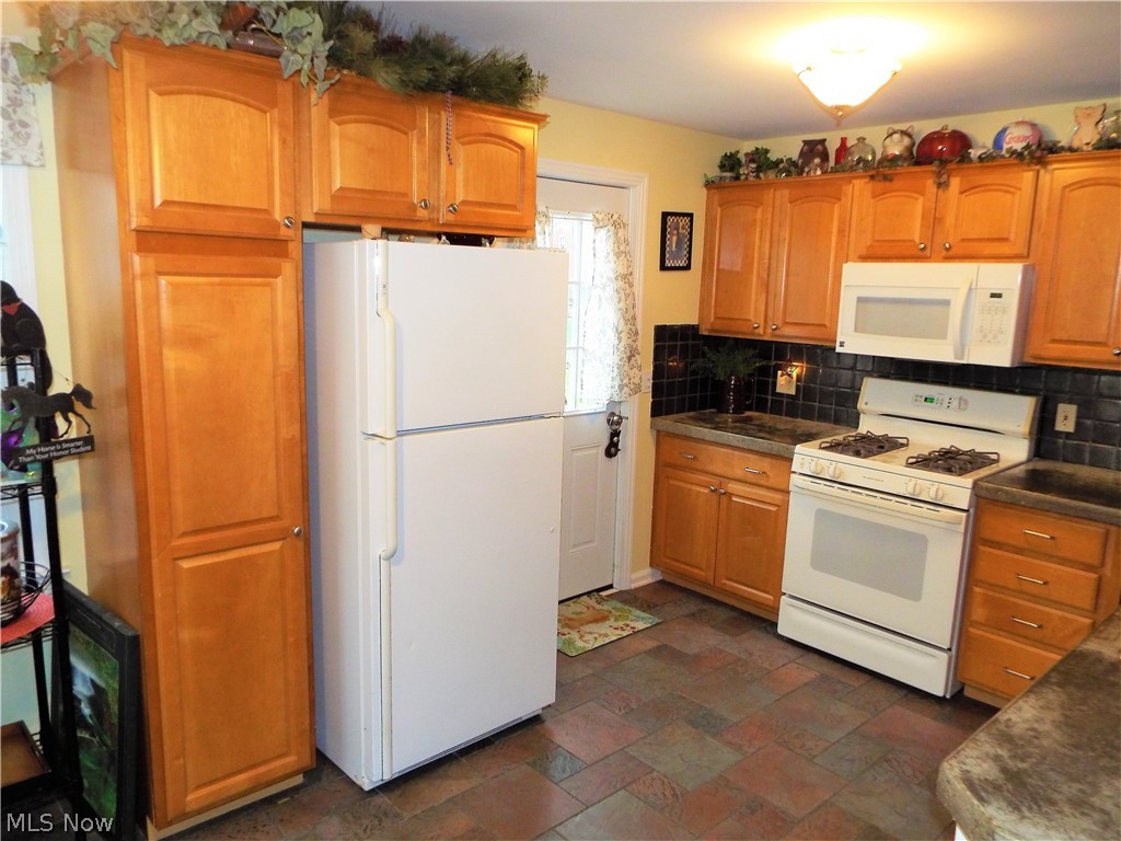 3012 Joseph Street Northwest Canton, OH 44708 - Photo 11 of 24 KITCHEN - WOOD CABINETS WITH TILE BACK SPLASH