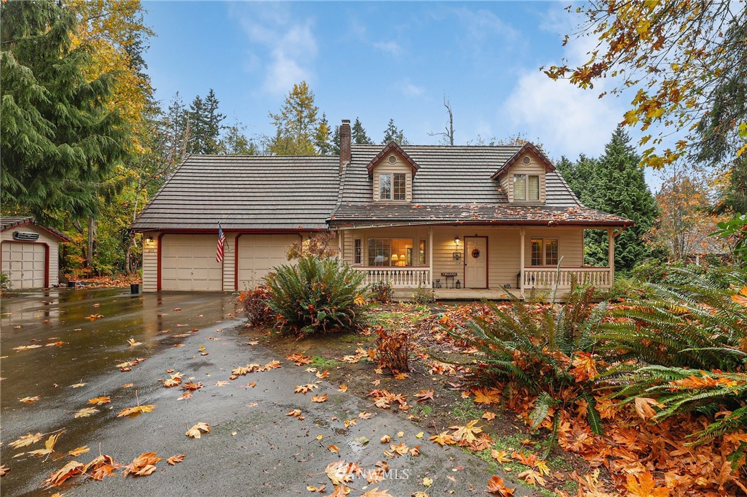 4313 212th Street Southeast Bothell, WA 98021 - Photo 1 of 40 a front view of a house with a yard