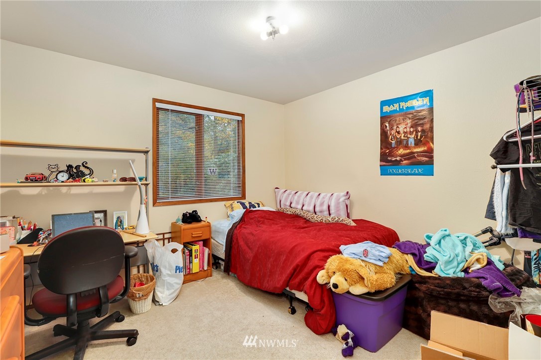 4313 212th Street Southeast Bothell, WA 98021 - Photo 14 of 40 a bedroom with bed and a workspace