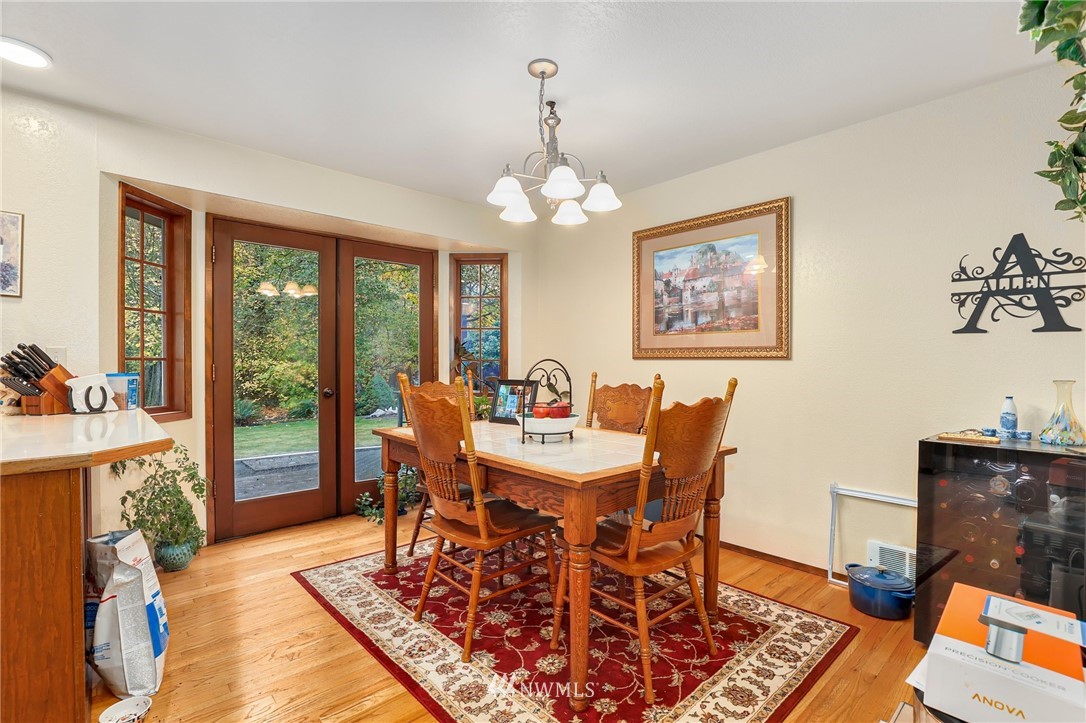 4313 212th Street Southeast Bothell, WA 98021 - Photo 8 of 40 a view of a dining room with furniture window and wooden floor