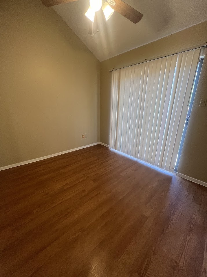 2210 Pearl Street, Unit 302 Austin, TX 78705 - Photo 14 of 18 an empty room with wooden floor and windows