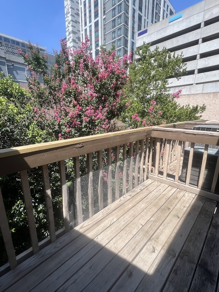 2210 Pearl Street, Unit 302 Austin, TX 78705 - Photo 18 of 18 a balcony with wooden floor