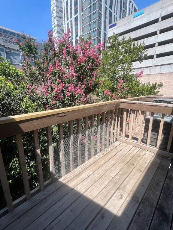 2210 Pearl Street, Unit 302 Austin, TX 78705 - Photo 18 of 18 a balcony with wooden floor