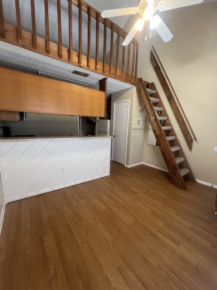 2210 Pearl Street, Unit 302 Austin, TX 78705 - Photo 8 of 18 a view of an empty room with stairs