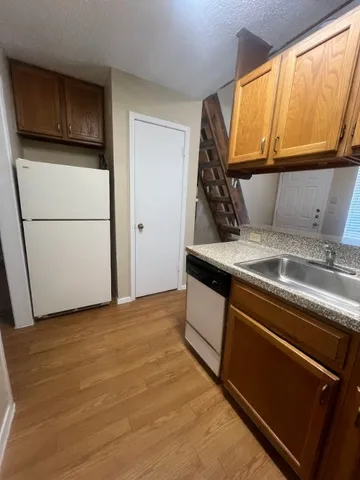 a kitchen with a stove and a microwave