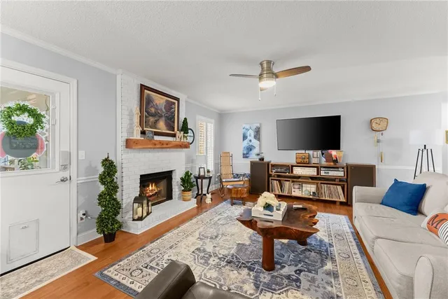 a view of a dining room with furniture and a chandelier