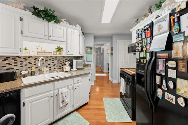 a stove top oven sitting inside of a kitchen