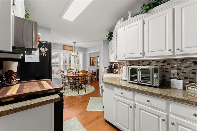 a bedroom with furniture and a book shelf