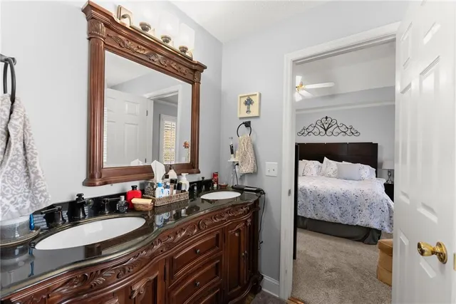 a living room with furniture a rug and a wall painting