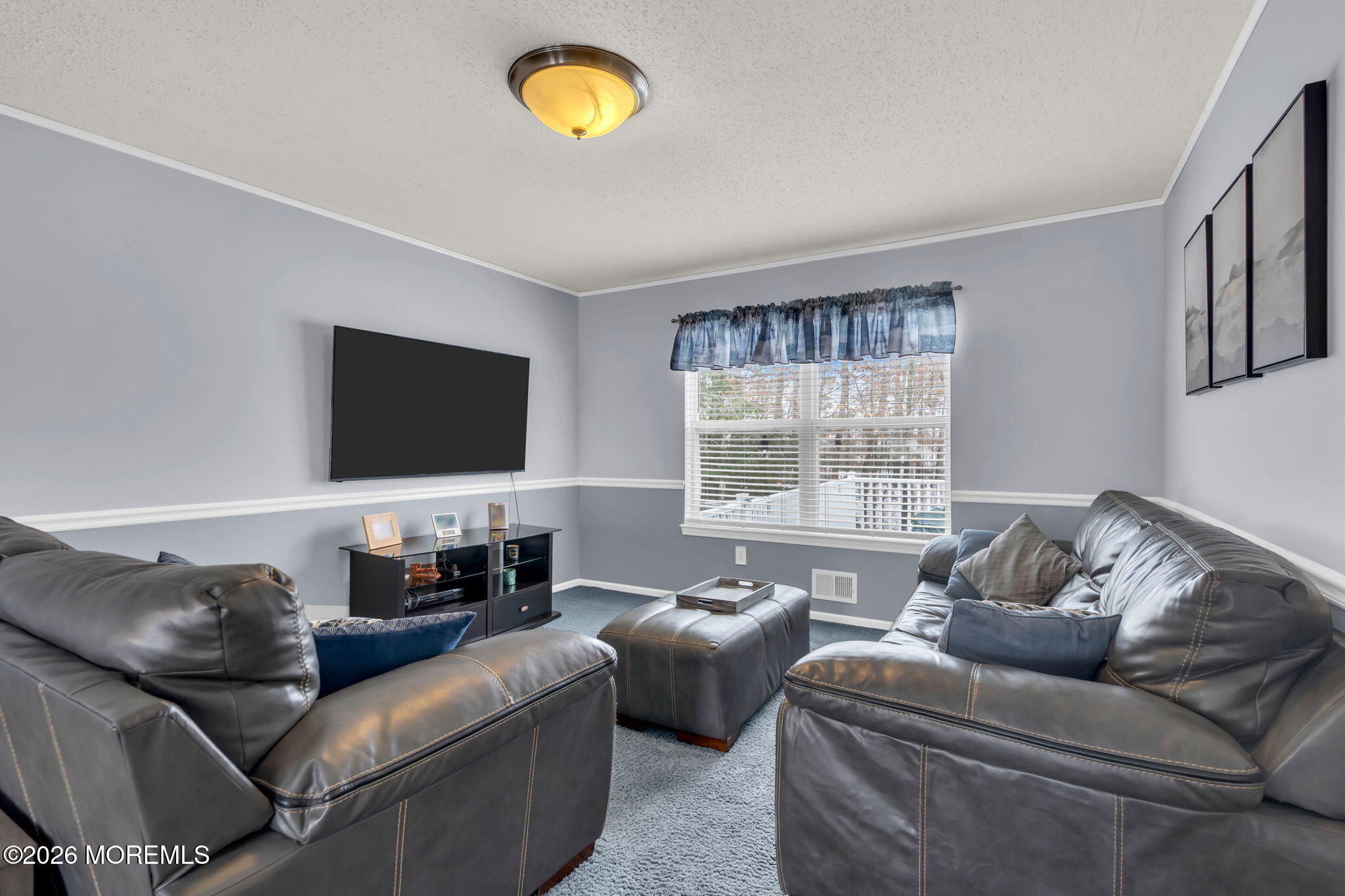 93 West Shenendoah Road Howell, NJ 07731 - Photo 11 of 30 a living room with furniture and a flat screen tv