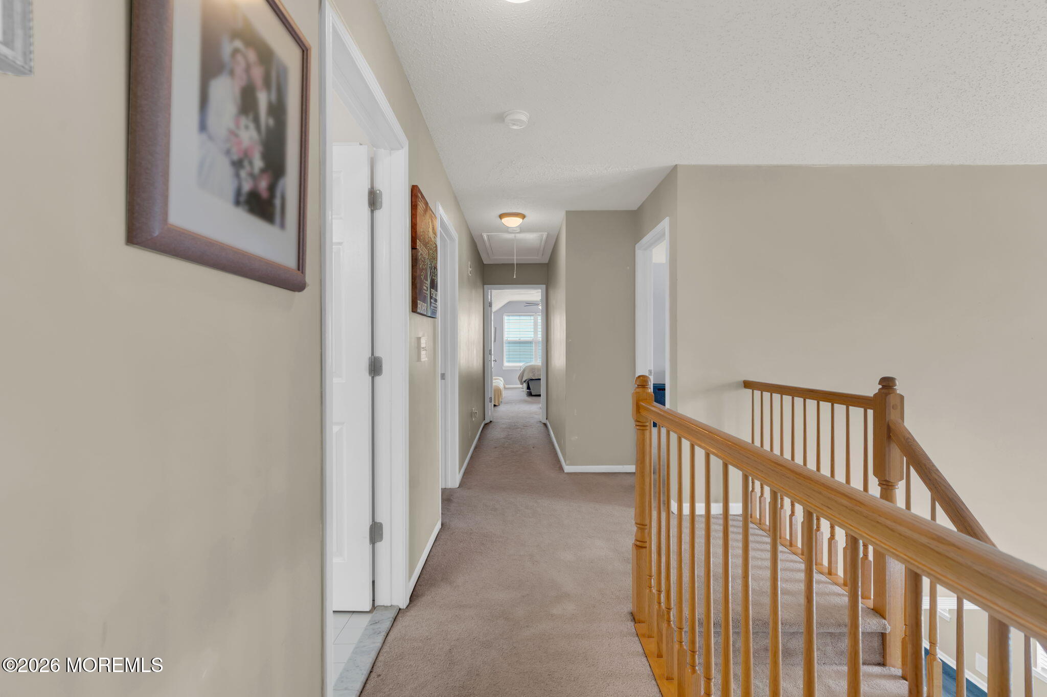 93 West Shenendoah Road Howell, NJ 07731 - Photo 20 of 30 a view of a hallway with paintings on the wall