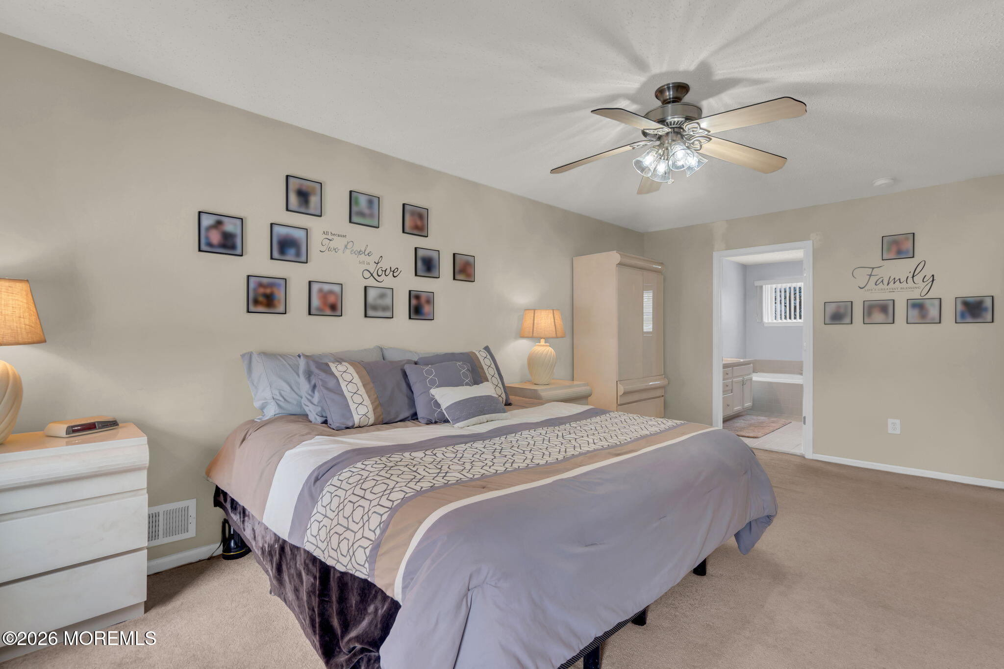 93 West Shenendoah Road Howell, NJ 07731 - Photo 21 of 30 a bedroom with a large bed and a chandelier