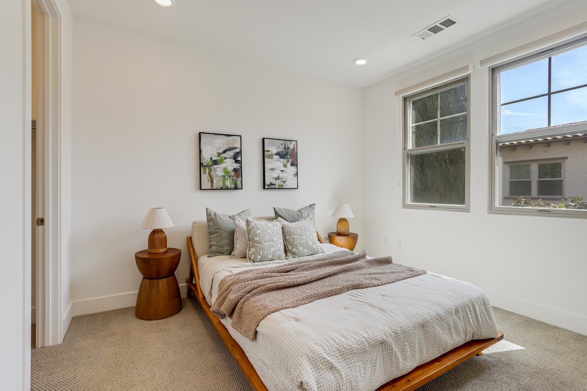 14 Catania Common Fremont, CA 94536 - Photo 24 of 39 a bedroom with a bed and painting on the wall
