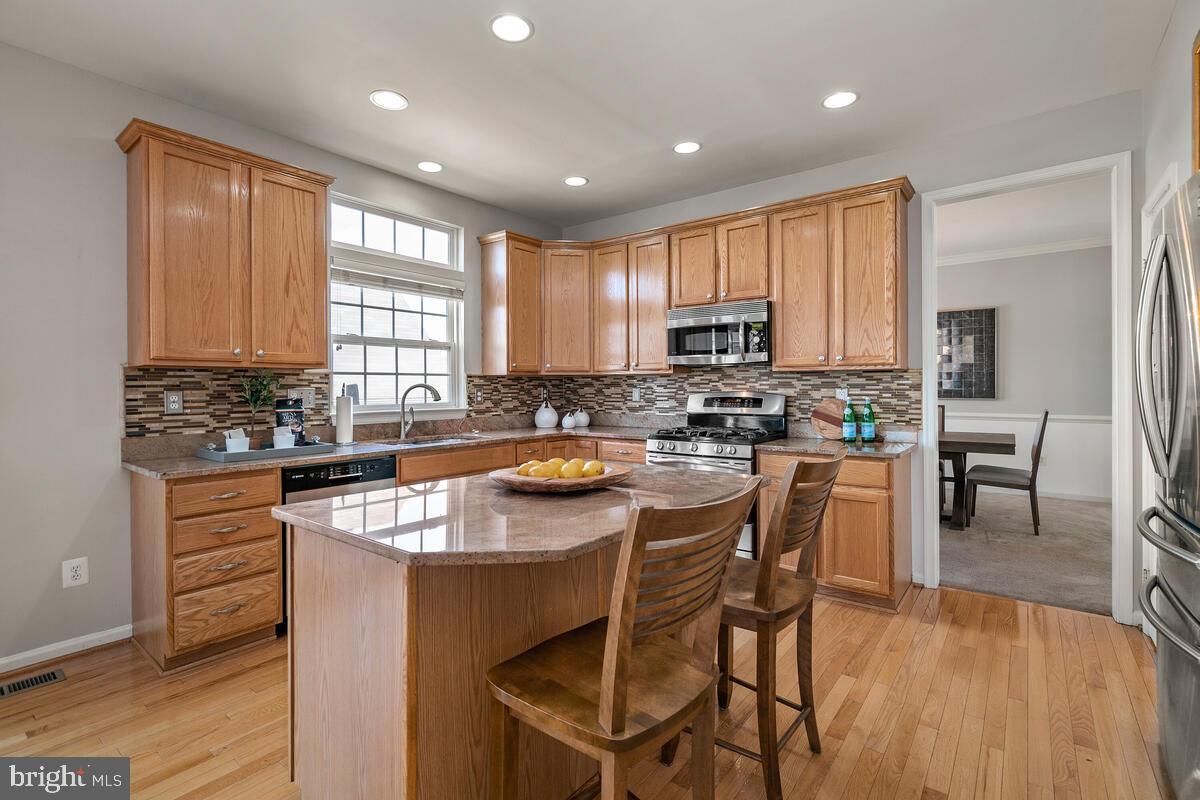 18414 Cornflower Road Boyds, MD 20841 - Photo 19 of 63 Table Space Kitchen with Center Island