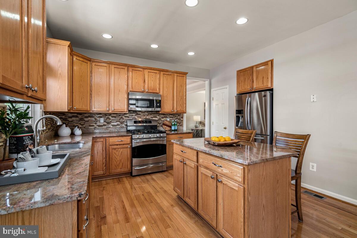 18414 Cornflower Road Boyds, MD 20841 - Photo 20 of 63 Table Space Kitchen with Center Island