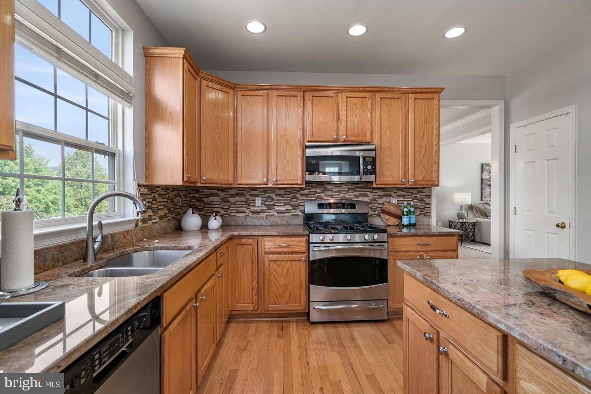 18414 Cornflower Road Boyds, MD 20841 - Photo 21 of 63 Table Space Kitchen with Center Island