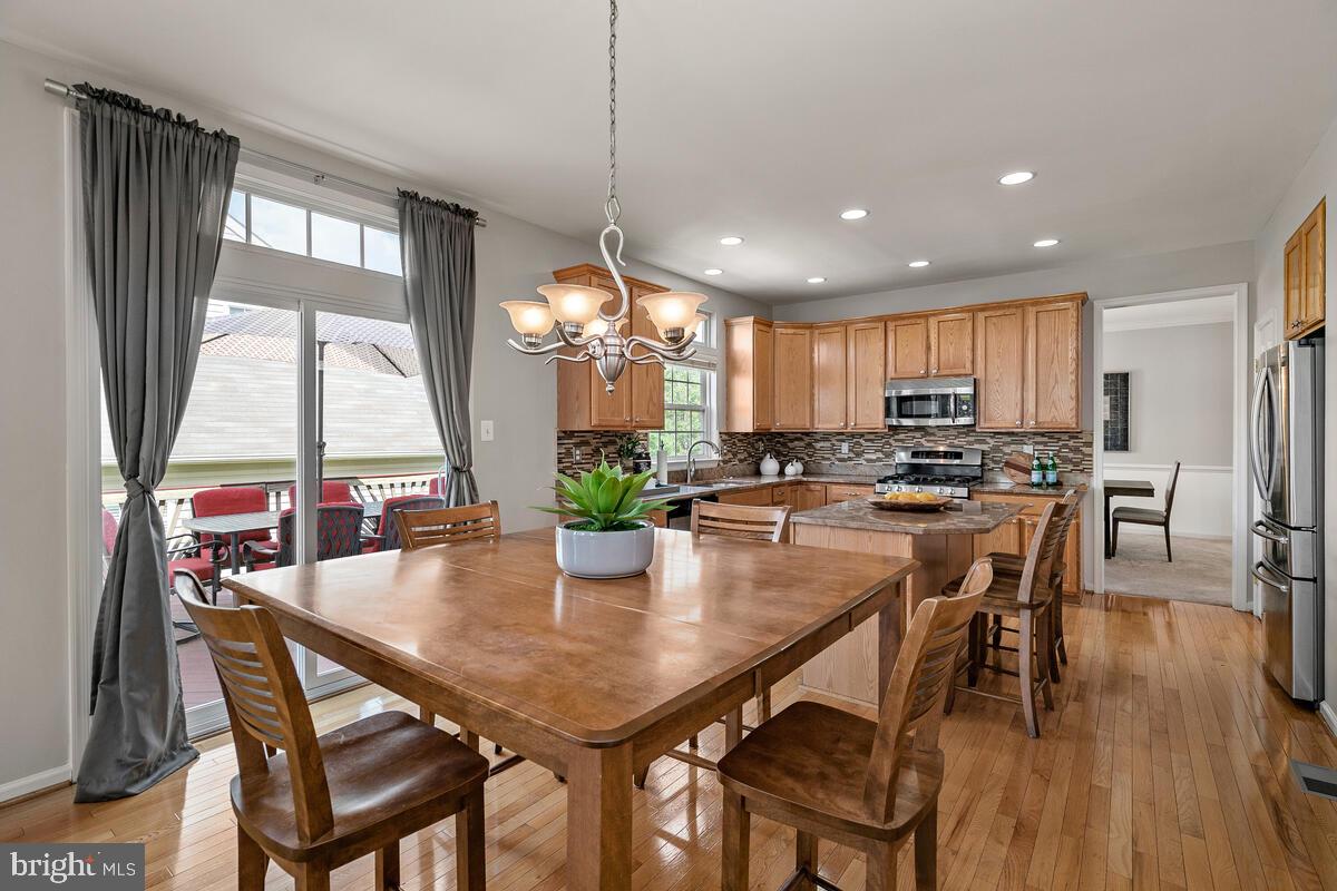 18414 Cornflower Road Boyds, MD 20841 - Photo 25 of 63 Table Space Kitchen with Deck Access