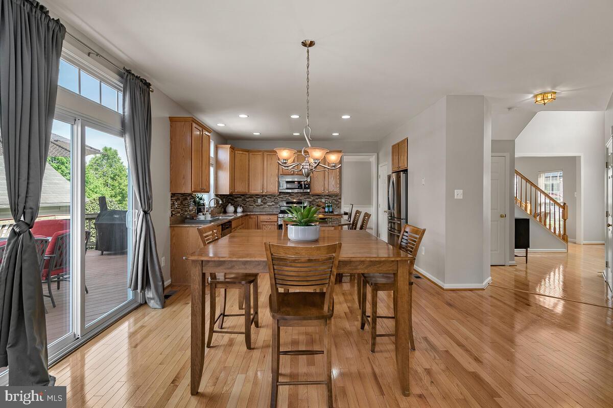 18414 Cornflower Road Boyds, MD 20841 - Photo 26 of 63 Table Space Kitchen with Deck Access