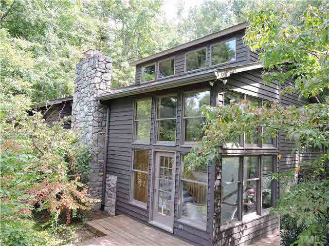 322 Raintree Road Timberlake, NC 27583 - Photo 1 of 25 a front view of a house with a yard