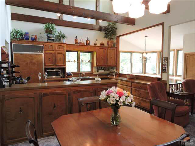 322 Raintree Road Timberlake, NC 27583 - Photo 5 of 25 a kitchen with a table and chairs