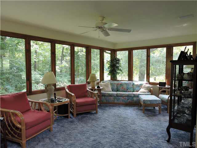 322 Raintree Road Timberlake, NC 27583 - Photo 8 of 25 a living room with furniture and a large window