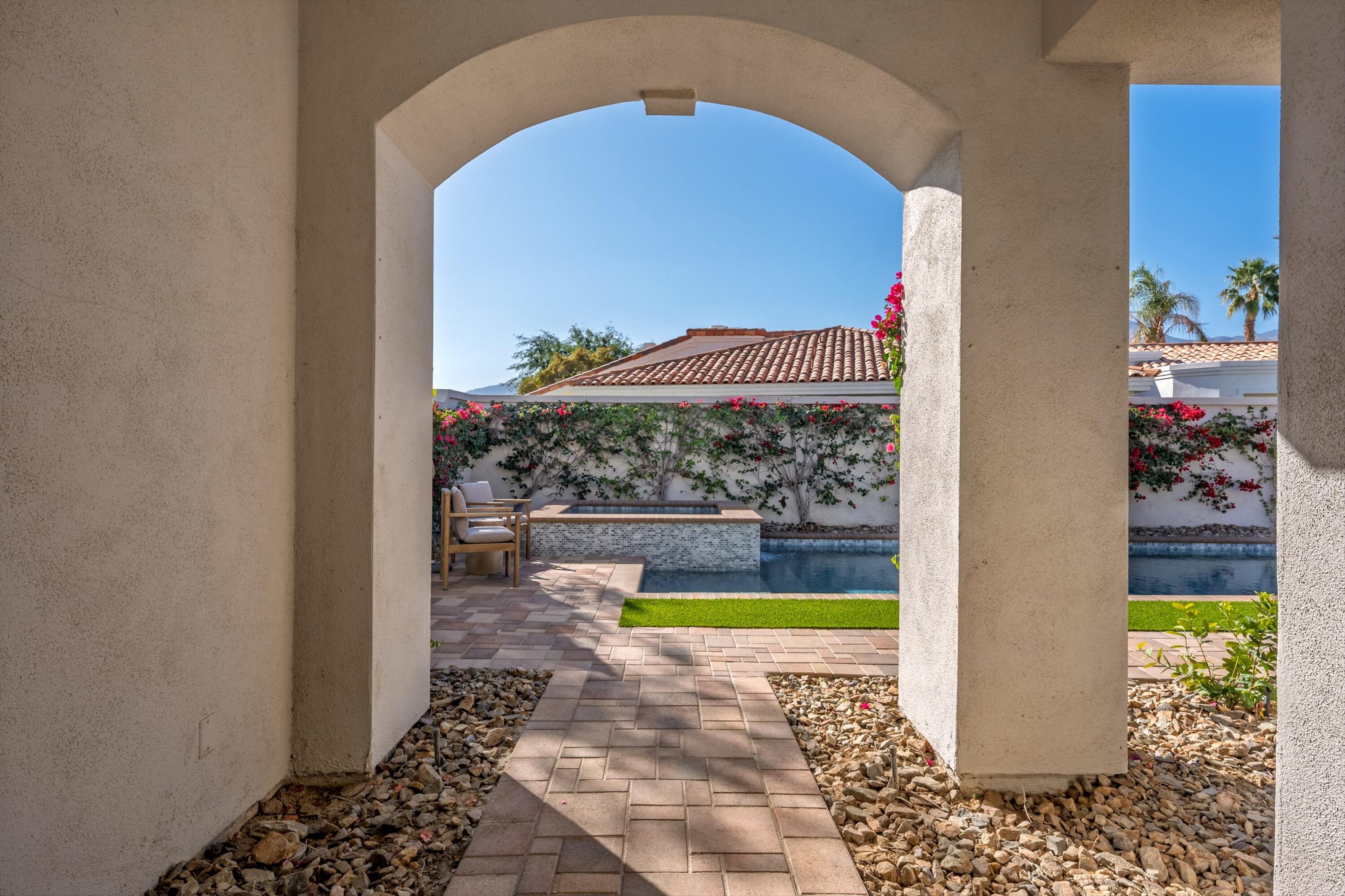 56300 Pebble Beach La Quinta, CA 92253 - Photo 14 of 45 a view of a swimming pool with a yard