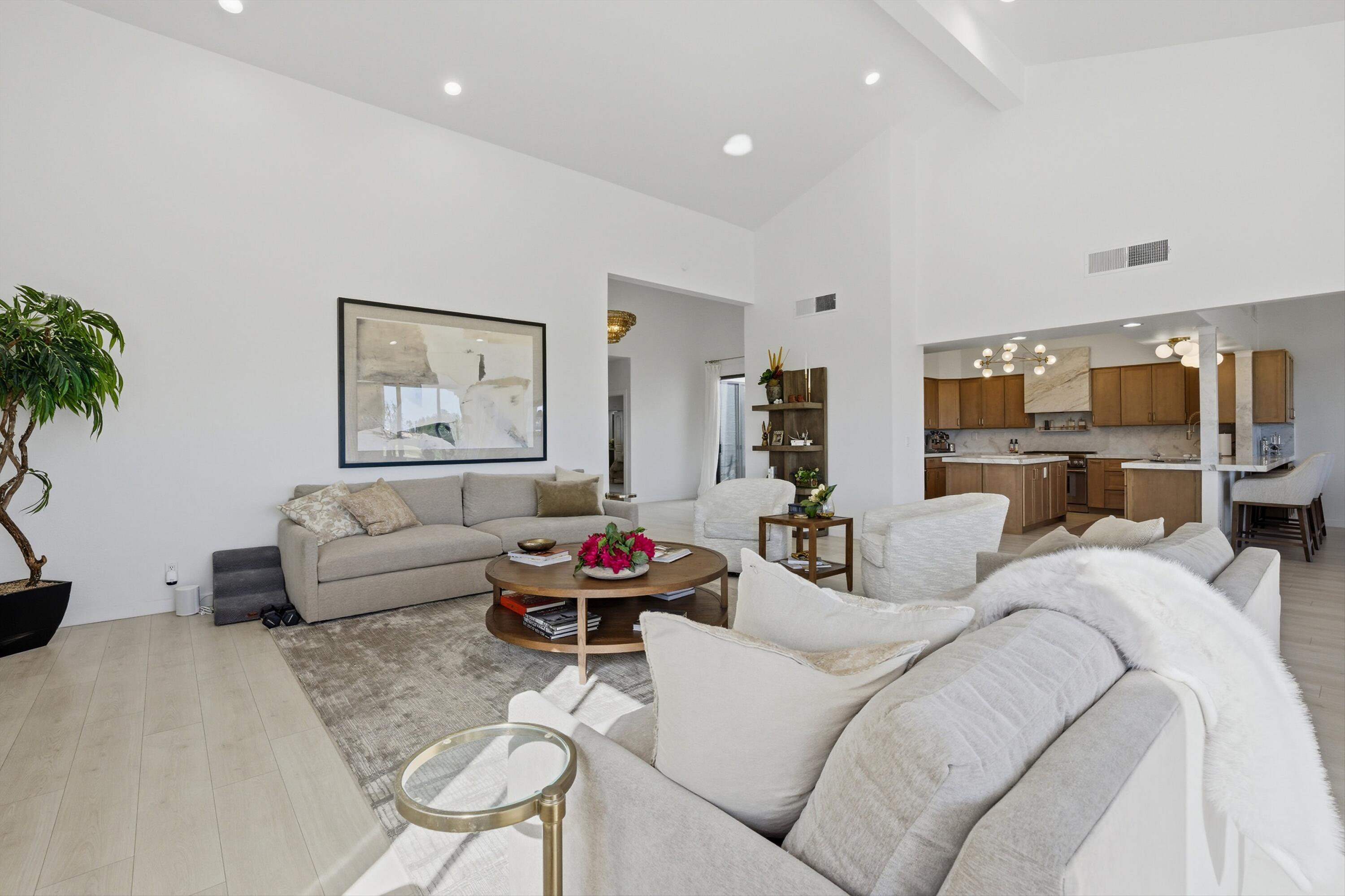 56300 Pebble Beach La Quinta, CA 92253 - Photo 21 of 45 a living room with furniture or couch and a potted plant