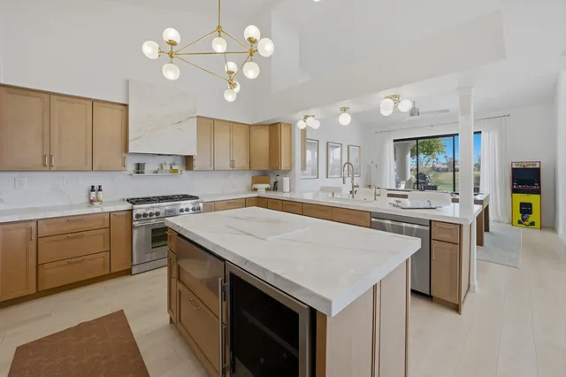 a kitchen with a stove a sink and a refrigerator