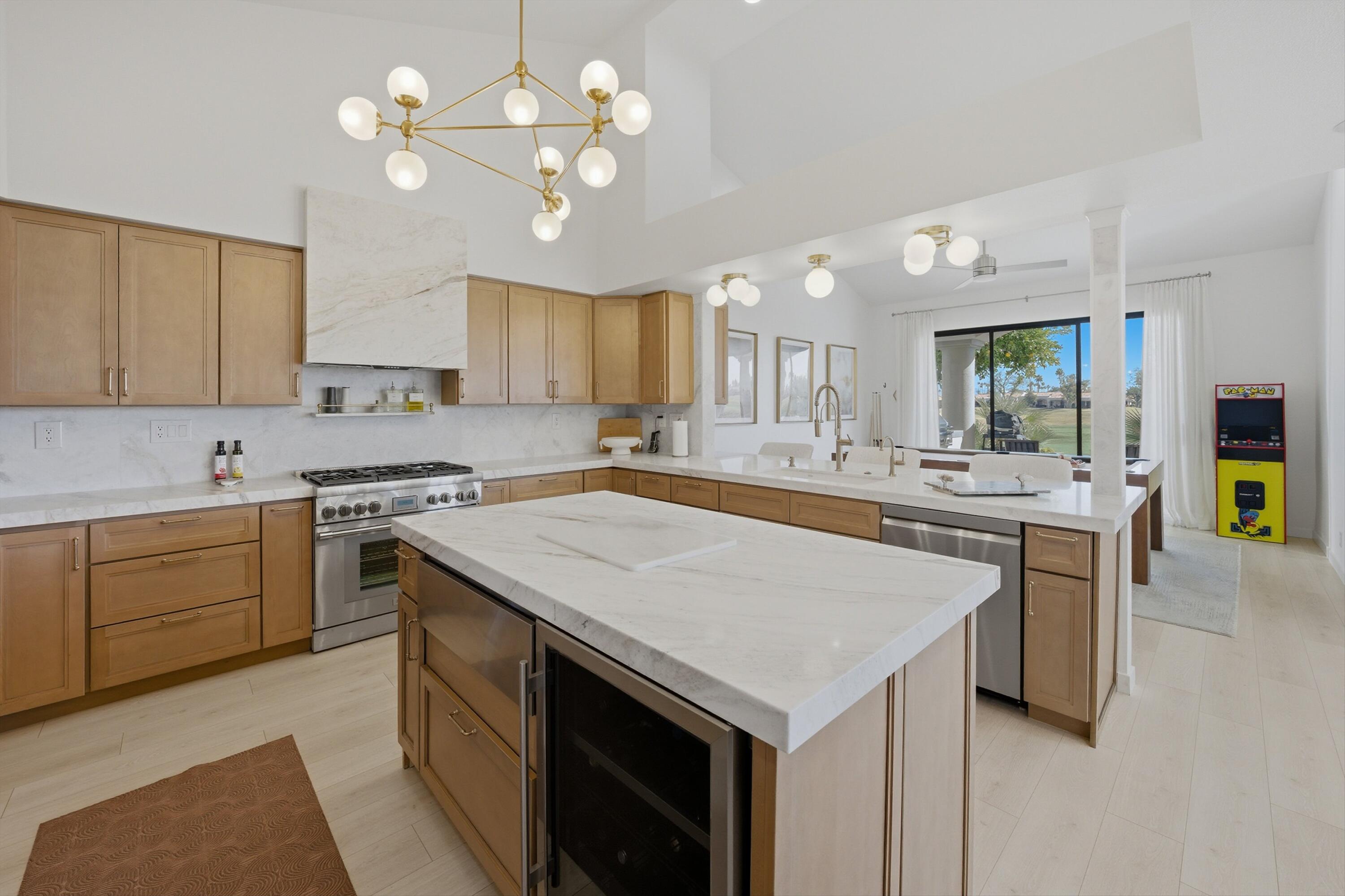 56300 Pebble Beach La Quinta, CA 92253 - Photo 28 of 45 a kitchen with a stove a sink and a refrigerator