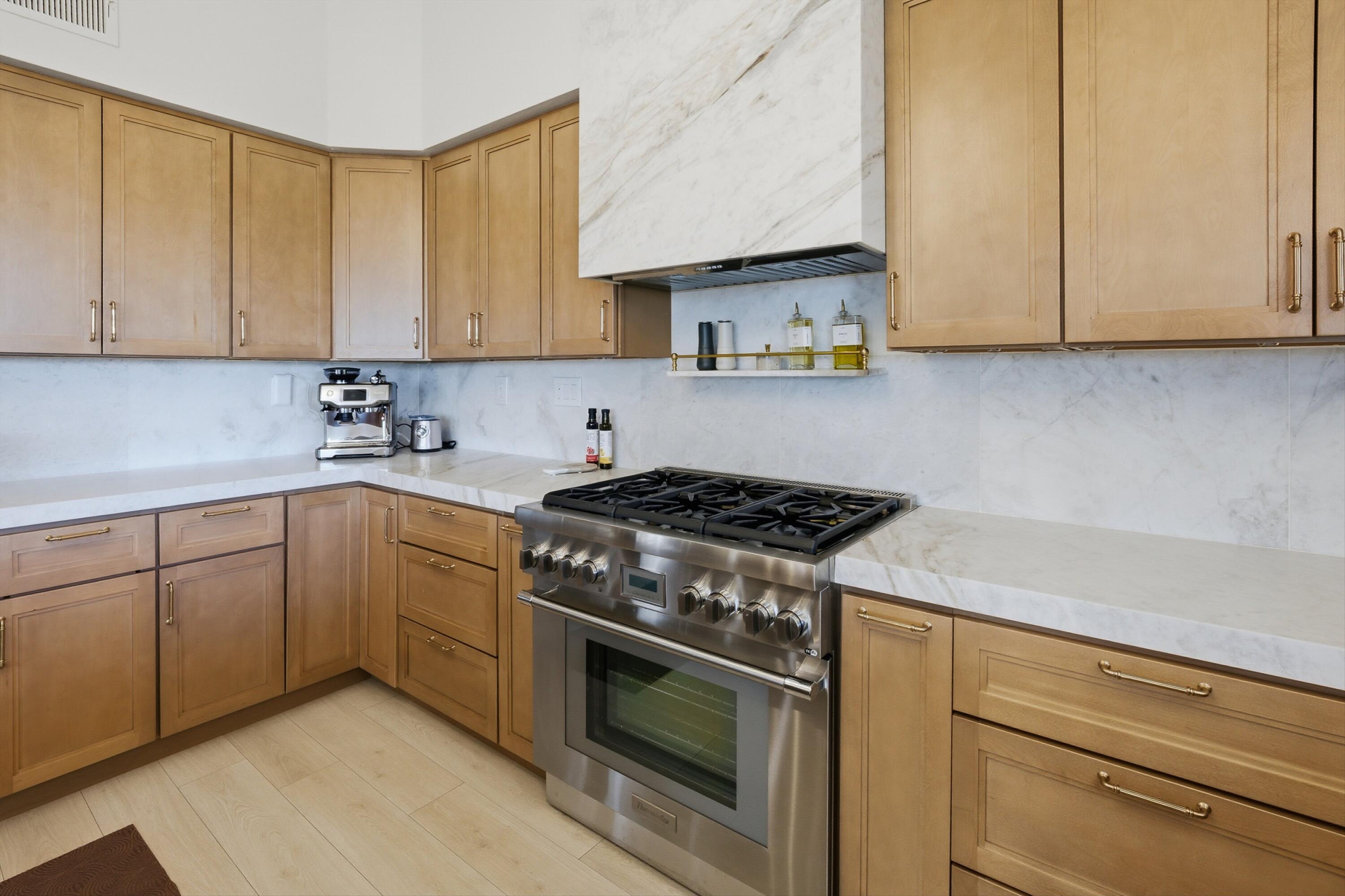56300 Pebble Beach La Quinta, CA 92253 - Photo 30 of 45 a kitchen with cabinets appliances and a sink