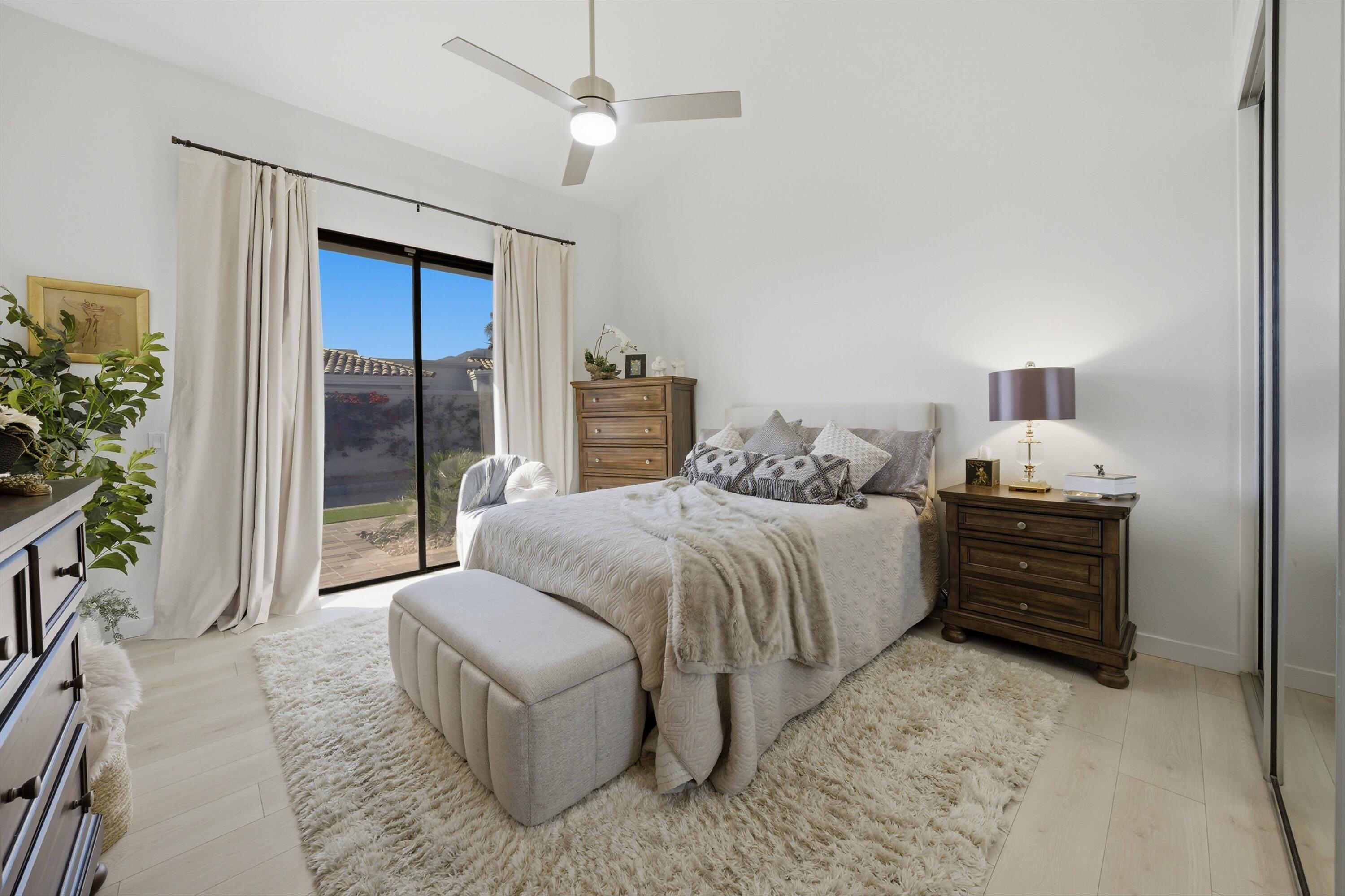 56300 Pebble Beach La Quinta, CA 92253 - Photo 33 of 45 a bedroom with a bed and a large window