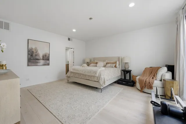 a bedroom with a bed and furniture