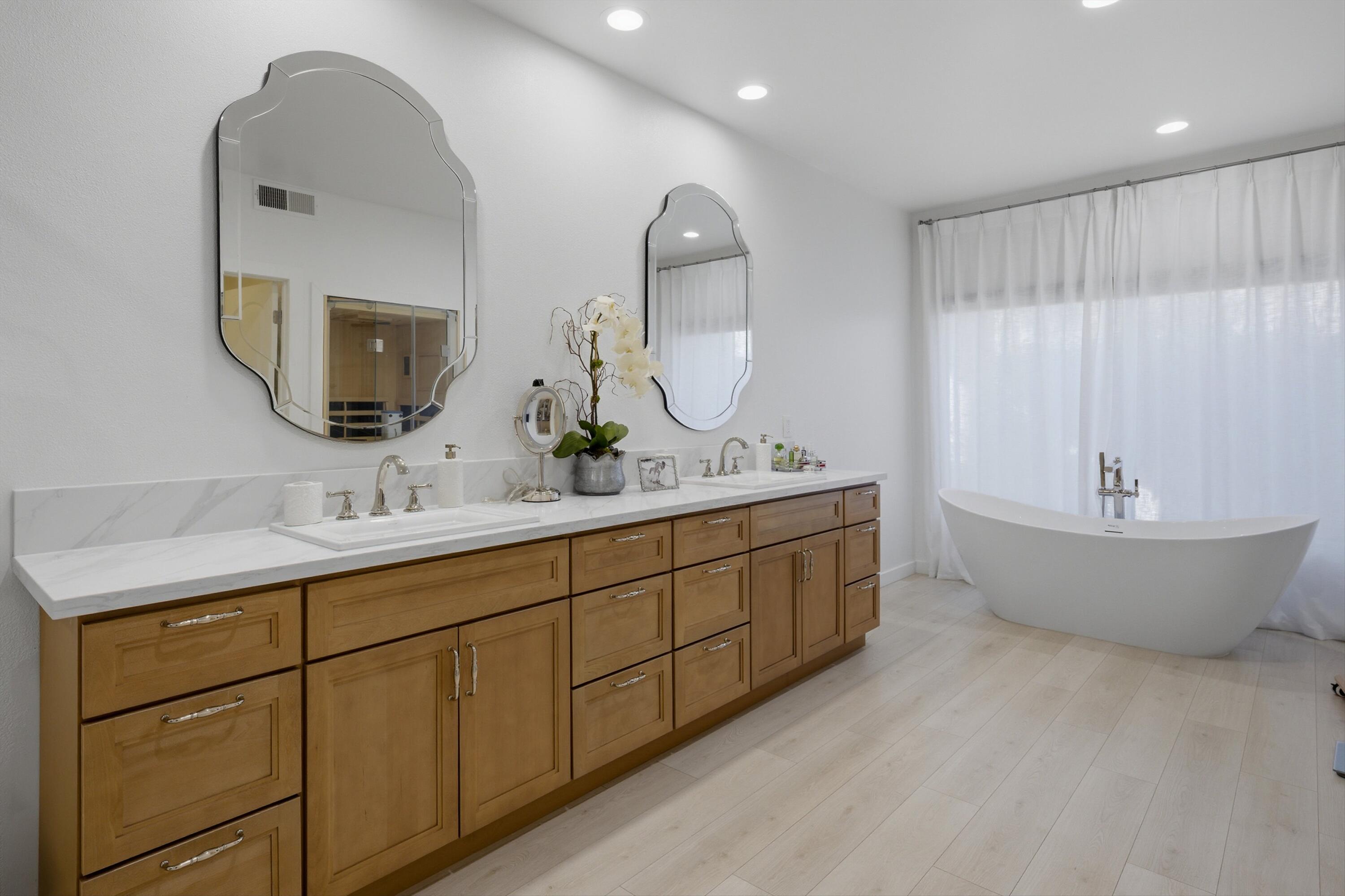 56300 Pebble Beach La Quinta, CA 92253 - Photo 42 of 45 a spacious bathroom with a double vanity sink mirror and bathtub