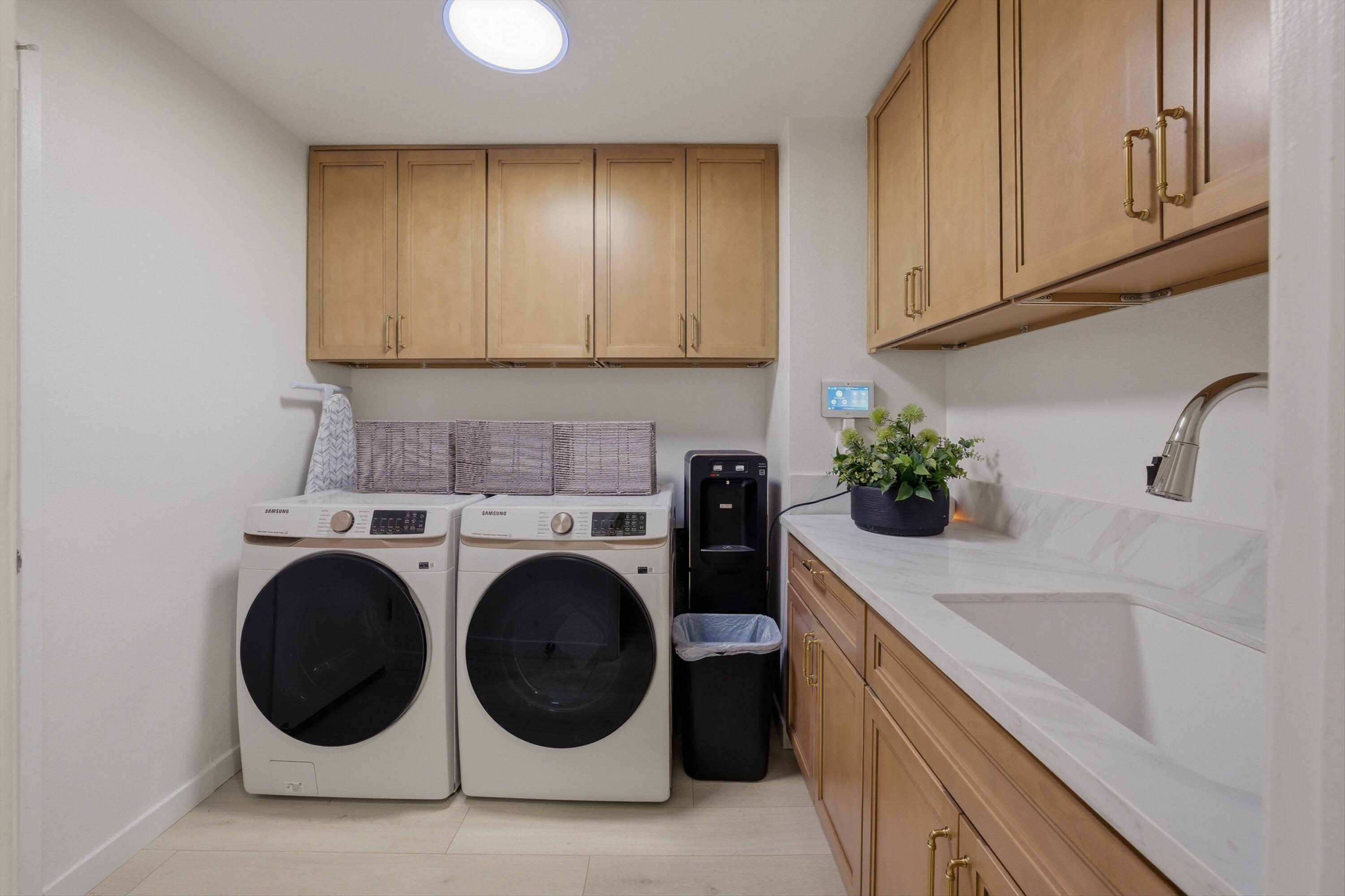 56300 Pebble Beach La Quinta, CA 92253 - Photo 45 of 45 a utility room with sink dryer and washer