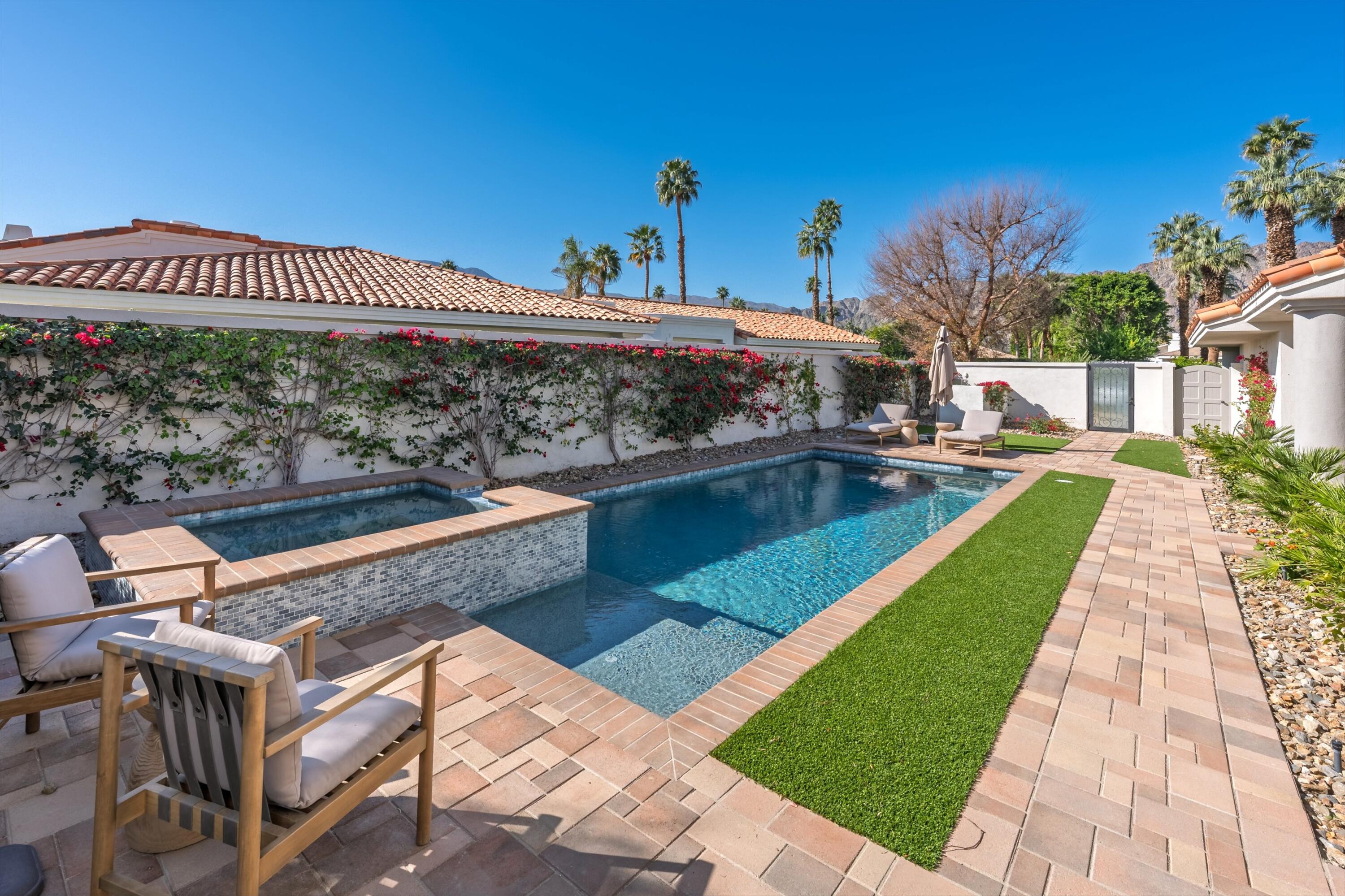 56300 Pebble Beach La Quinta, CA 92253 - Photo 8 of 45 a view of a swimming pool with a patio