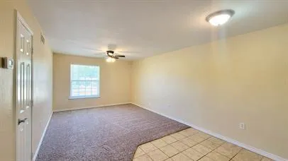 a view of an empty room and window