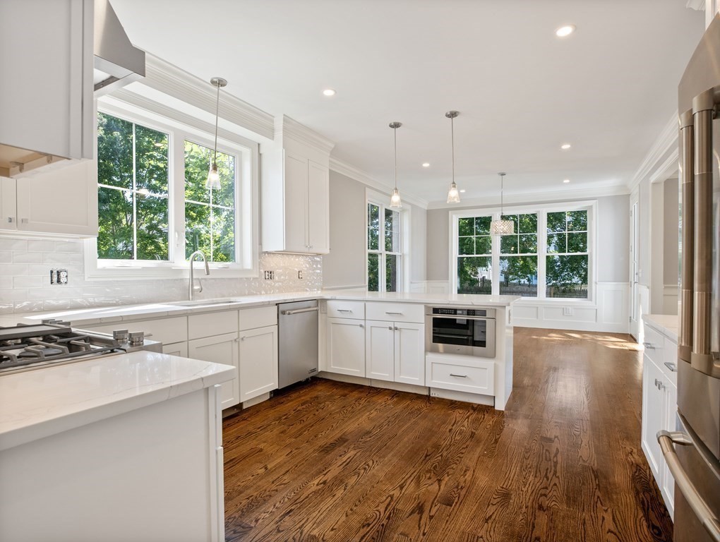 25 Larkin Road Newton, MA 02465 - Photo 3 of 27 a kitchen with a sink stove and wooden floor
