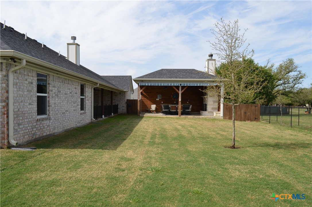 1026 County Road 3152 Kempner, TX 76539 - Photo 33 of 48 Fenced, Flat Back Yard Looking Toward the Outdoor Patio * Dog Run * The lot goes further back than the fence.