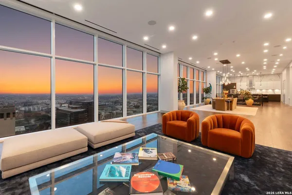 a living room with furniture and a large window