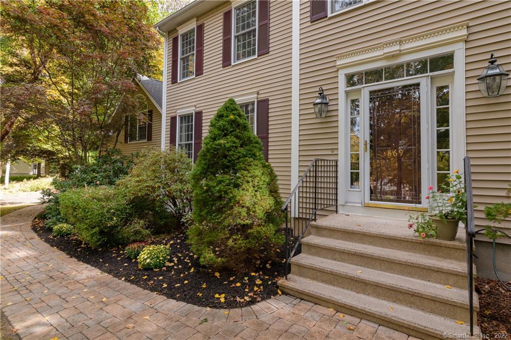869 North Madison Road Guilford, CT 06437 - Photo 1 of 1 a front view of a house with plants and garden