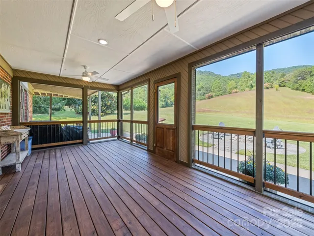 a view of hallway with wooden floor