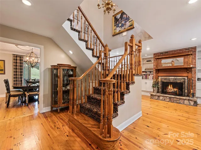 a view of entryway livingroom and hall with wooden floor