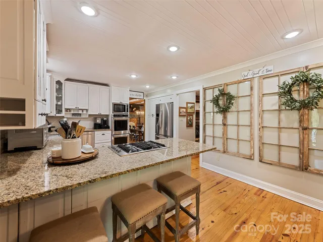 a kitchen with counter top space cabinets and stainless steel appliances