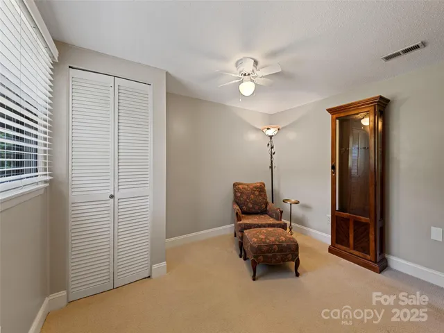 a bedroom with furniture and a window