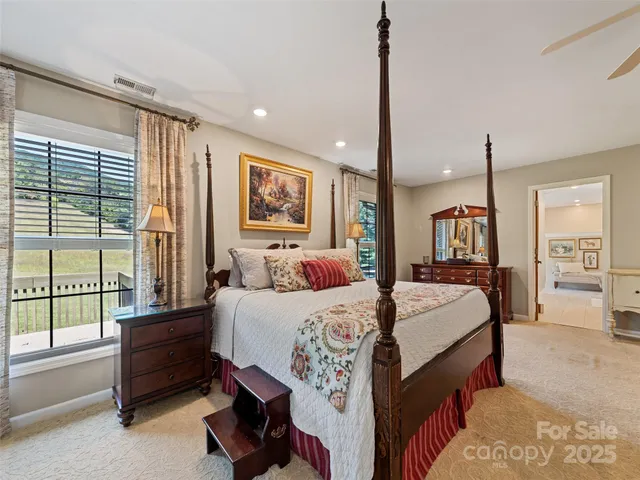 a bed room with a bed and a large window